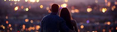 A couple on a date looking out on city lights