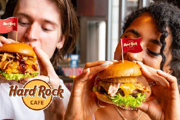 Two people enjoying a burger at Hard Rock Cafe